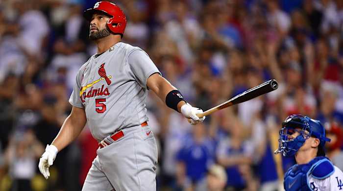 Albert Pujols stares in the air at the ball after hitting his 700th home run vs. the Los Angeles Dodgers.